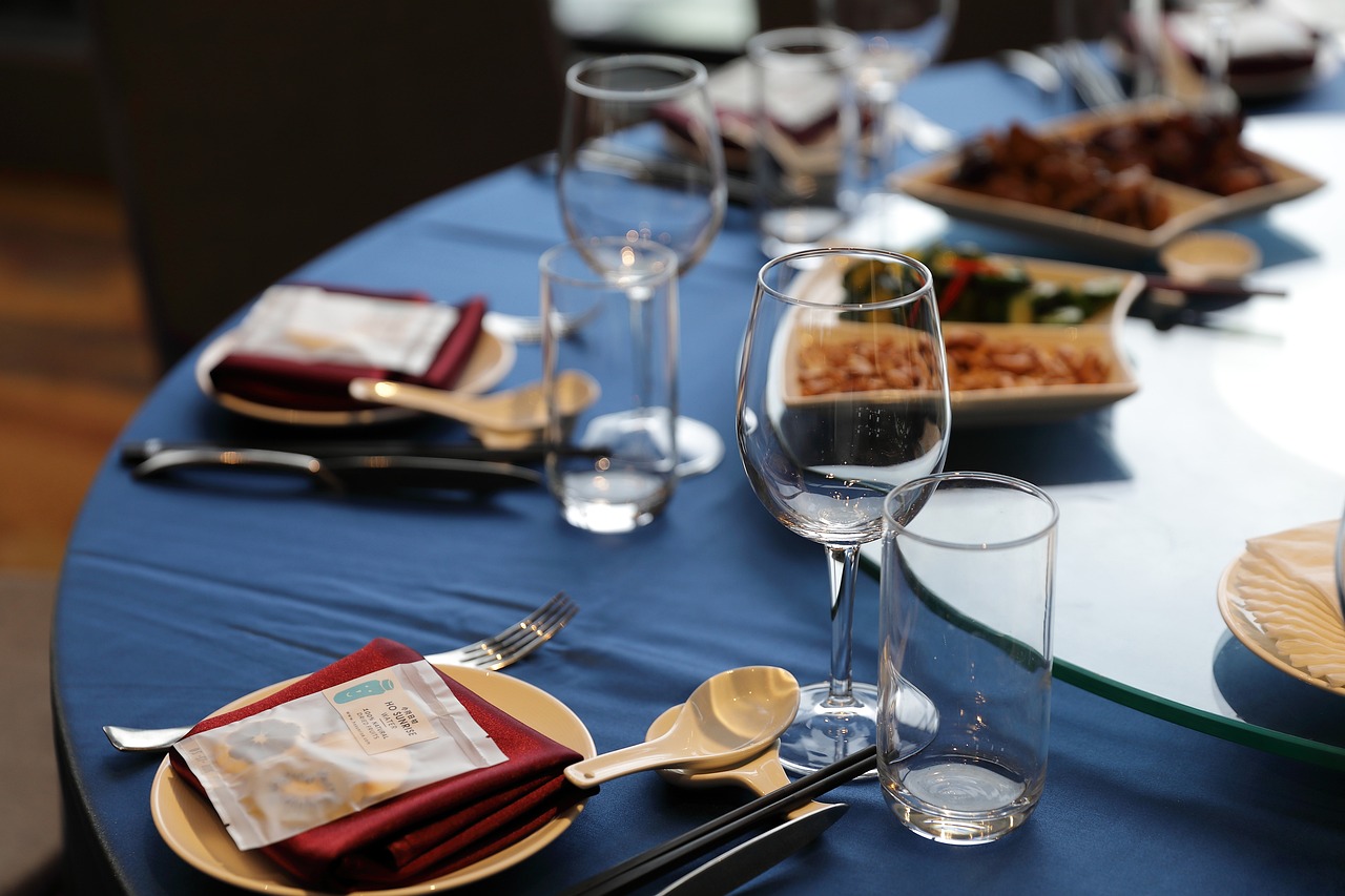 A beautifully decorated events decor table set with elegant dinnerware.